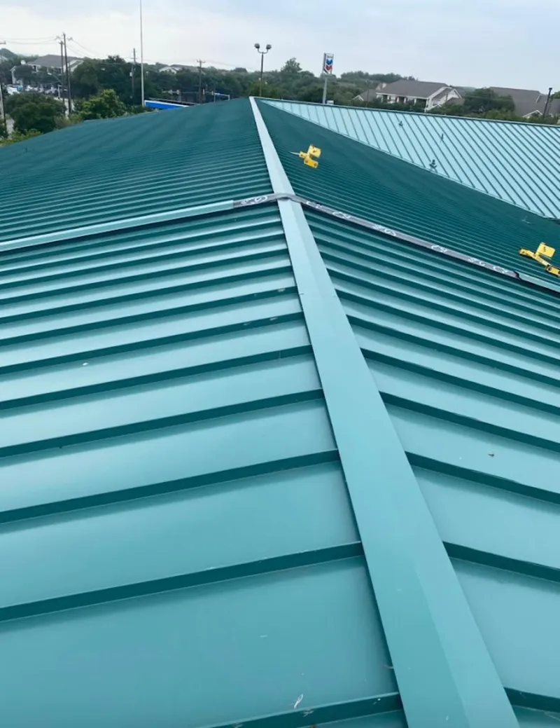 Green commercial metal roof ridge and valley for Metal Roof Repair in East Caln
